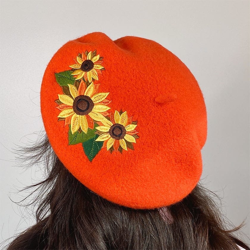 Orange baret med solsikke Accessories Erstwilder